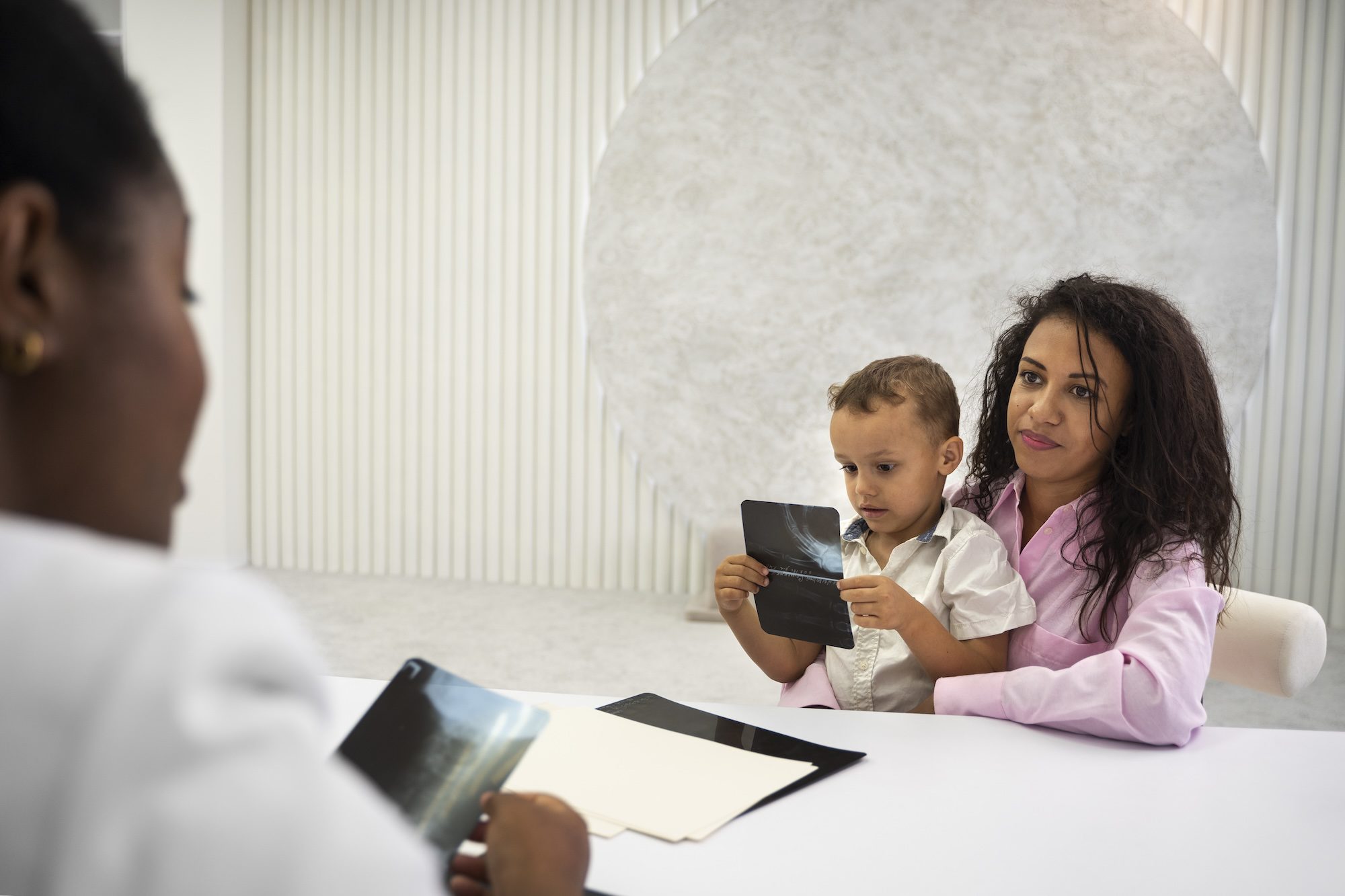 Pediatric Care at BritePath Medical Women holding a Child
