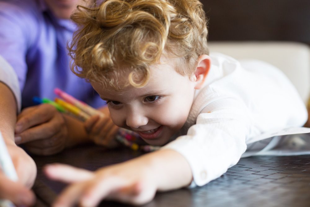 Child paying games on a table