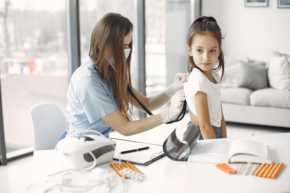 Doctor seeing a little girl