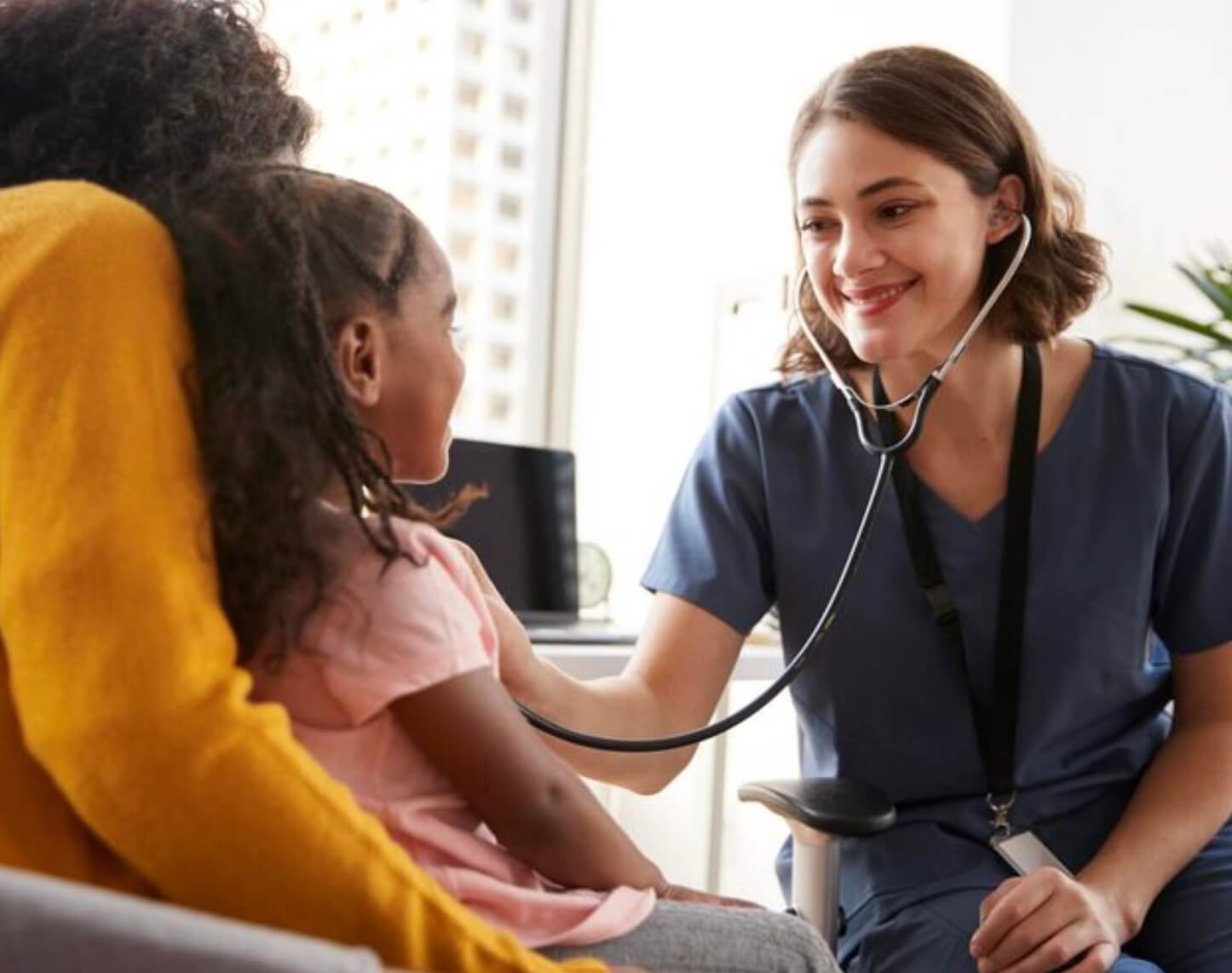 Doctor examining a young child patient
