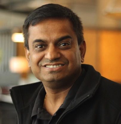 Smiling man in black jacket