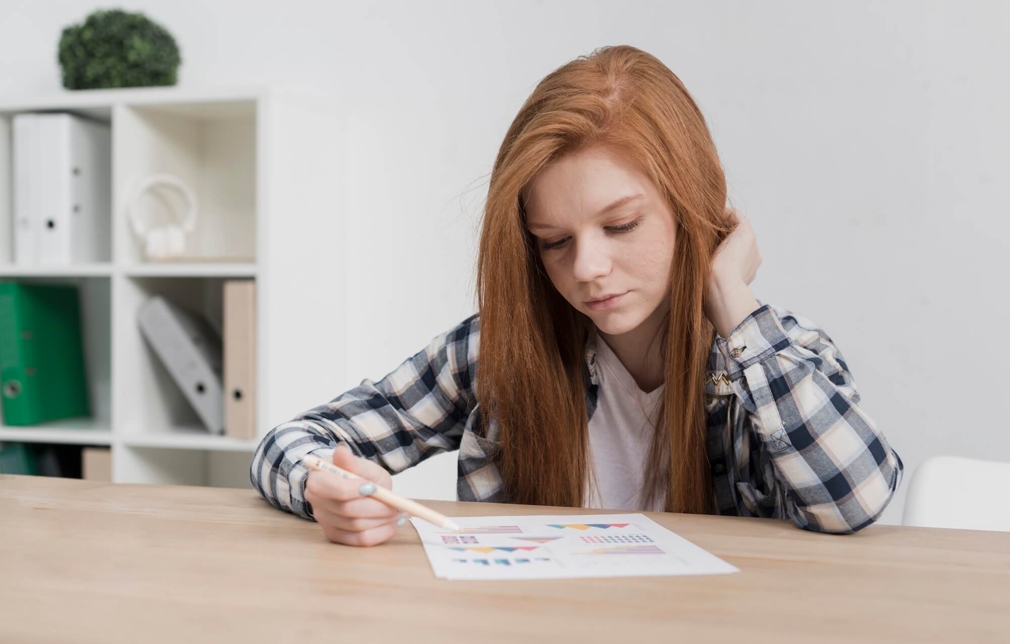 Young Girl Staring at Paper