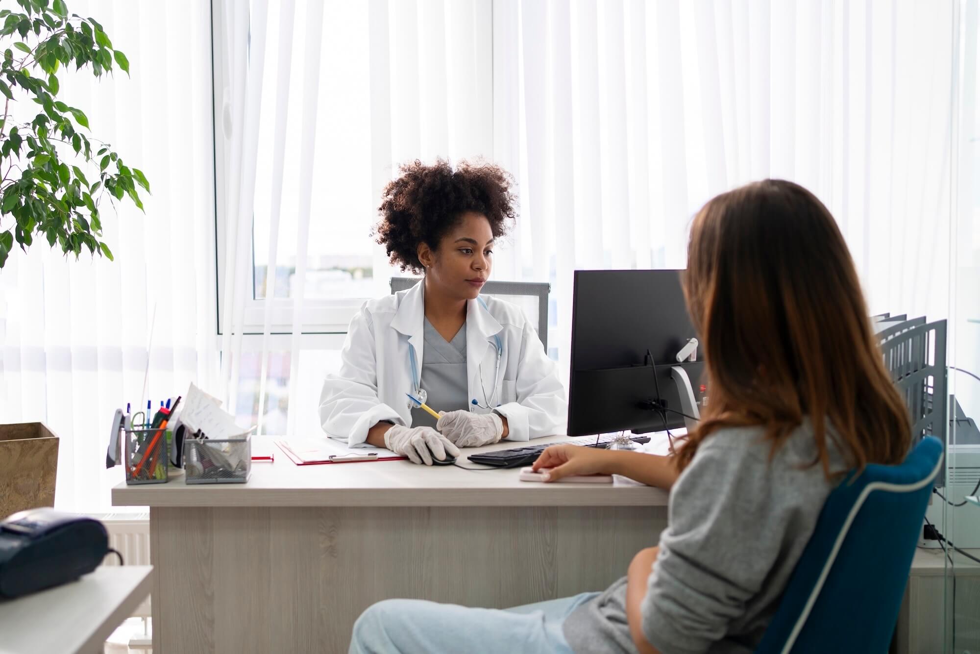 Female doctor consulting with a patient