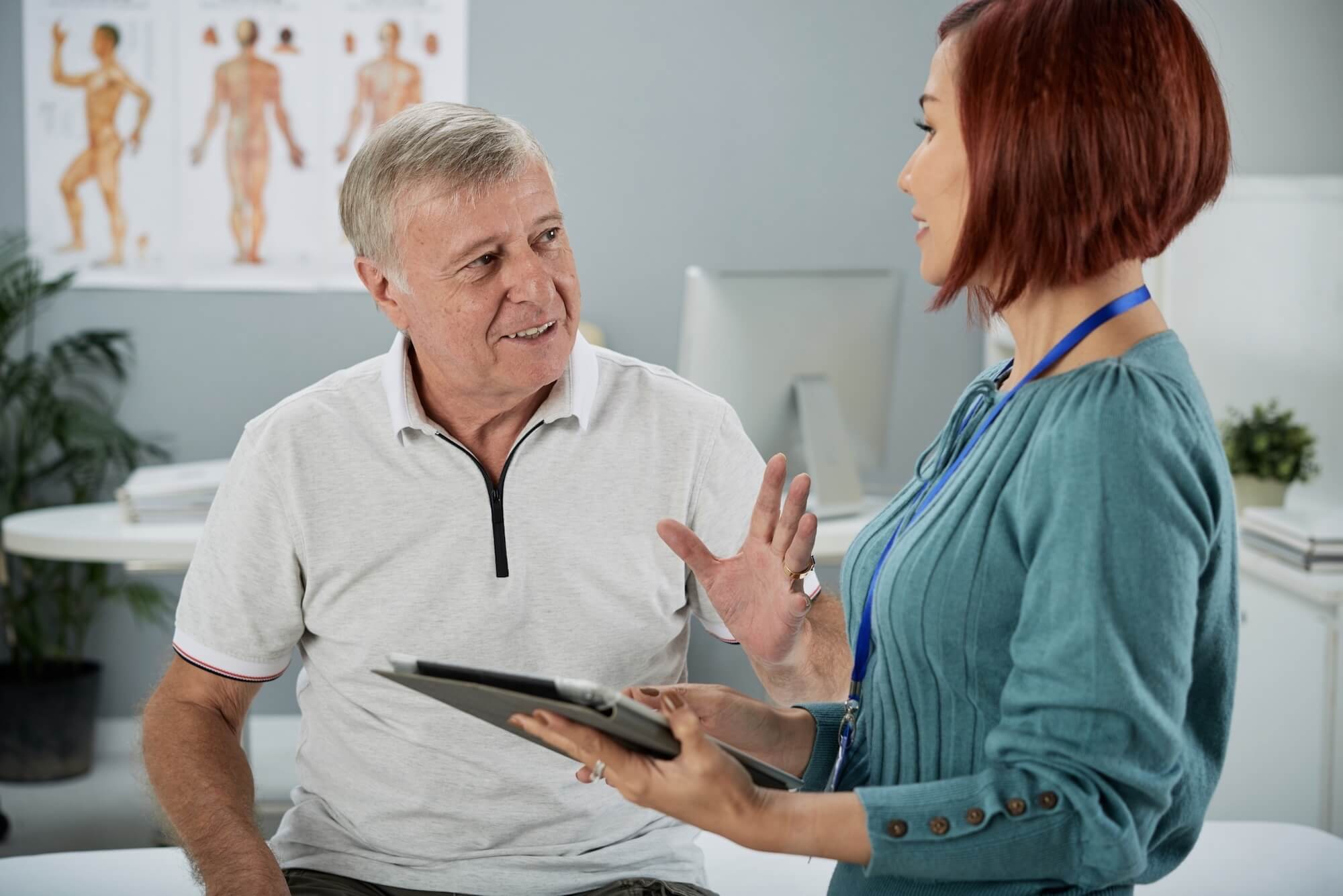 Provider talking to a old patient